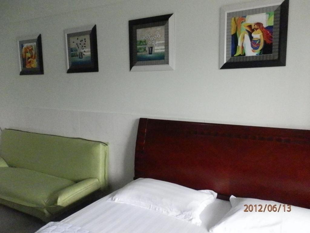 Xingfu Hotel Наньнин Номер фото