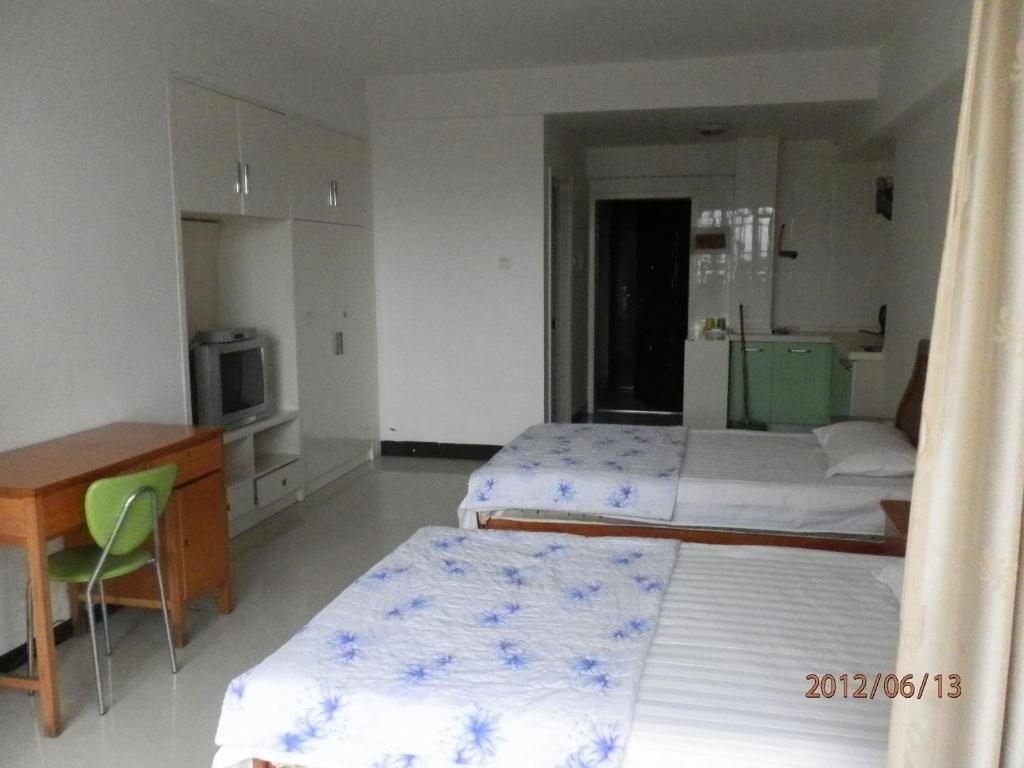 Xingfu Hotel Наньнин Номер фото